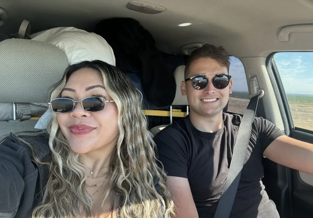 Ysabelle and Jordan in the car on the drive to Lightning in a Bottle
